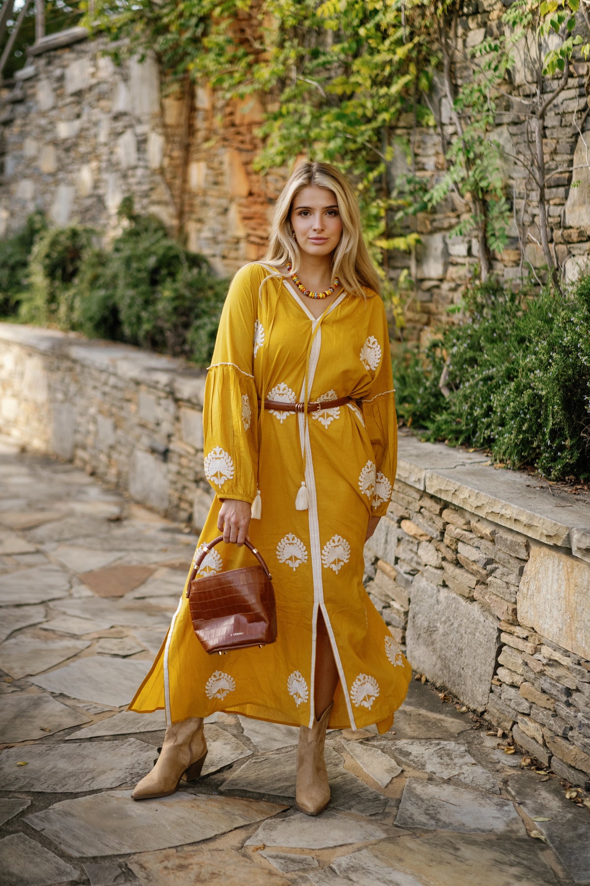 Bright yellow fabric swatch from Tela Luxury Mercantile's Mellow Yellow collection, showcasing soft, vibrant textile texture.