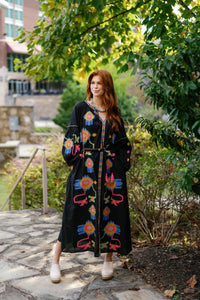 Black Fall Funk clothing by Tela Luxury Mercantile, front view showing fabric texture and stylish design details.