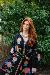 Black Fall Funk garment by Tela Luxury Mercantile, showing fabric texture and style details in a close-up image.