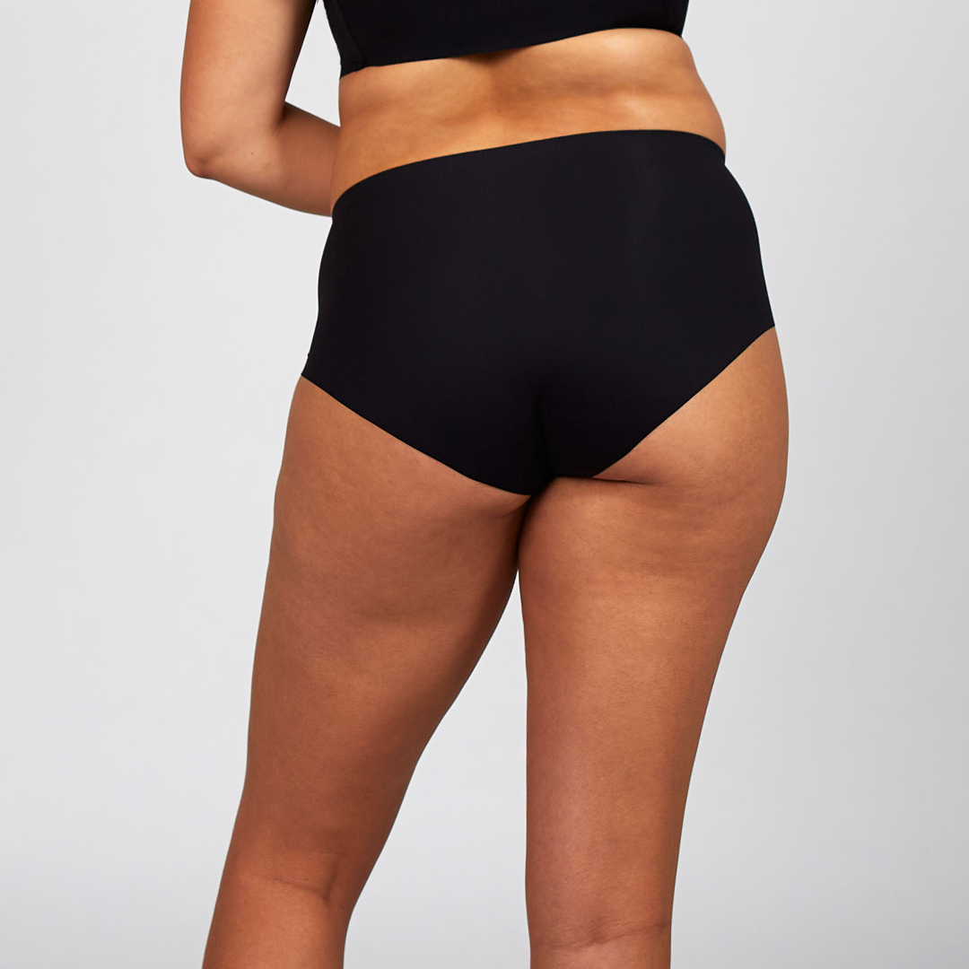 Black The Hi-Waist Hug from The Only Bra, high-waist shaping underwear, shown on a model.