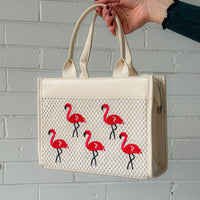 Pink leather Classic Flamingo Purse by The Popular Flamingo, featuring a stylish flamingo design and gold-tone hardware.