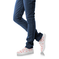 Pink Flamingo Love slip-on shoes for women by The Popular Flamingo, showing the stylish design and soft fabric upper.