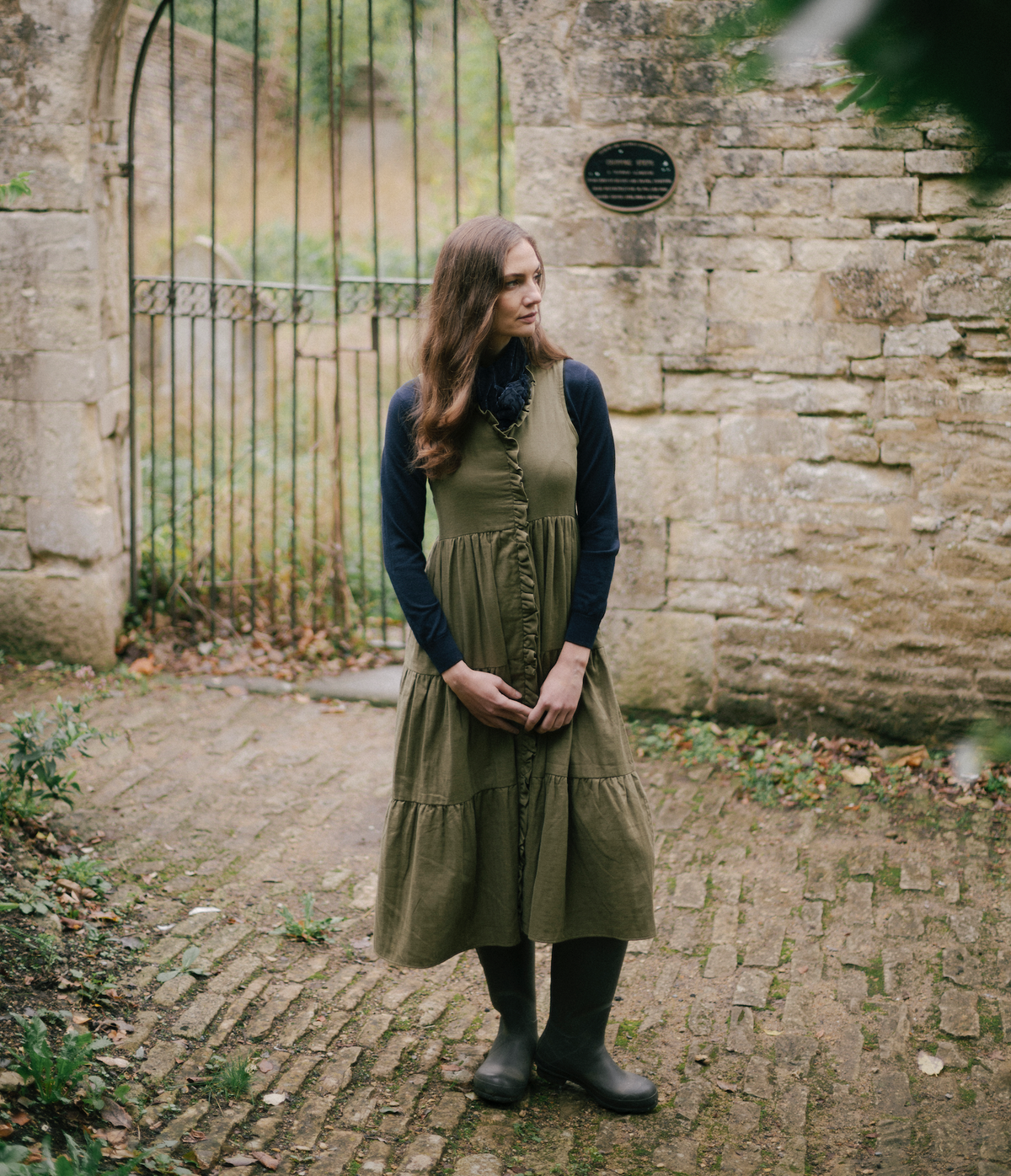The Village Green house dress displayed on a hanger, featuring a soft fabric and relaxed fit for comfortable loungewear.