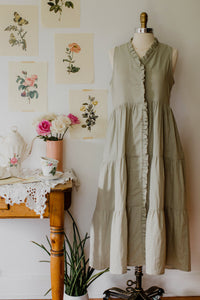 Light green house dress by The Village Green featuring a relaxed fit, short sleeves, and a comfortable, casual design.