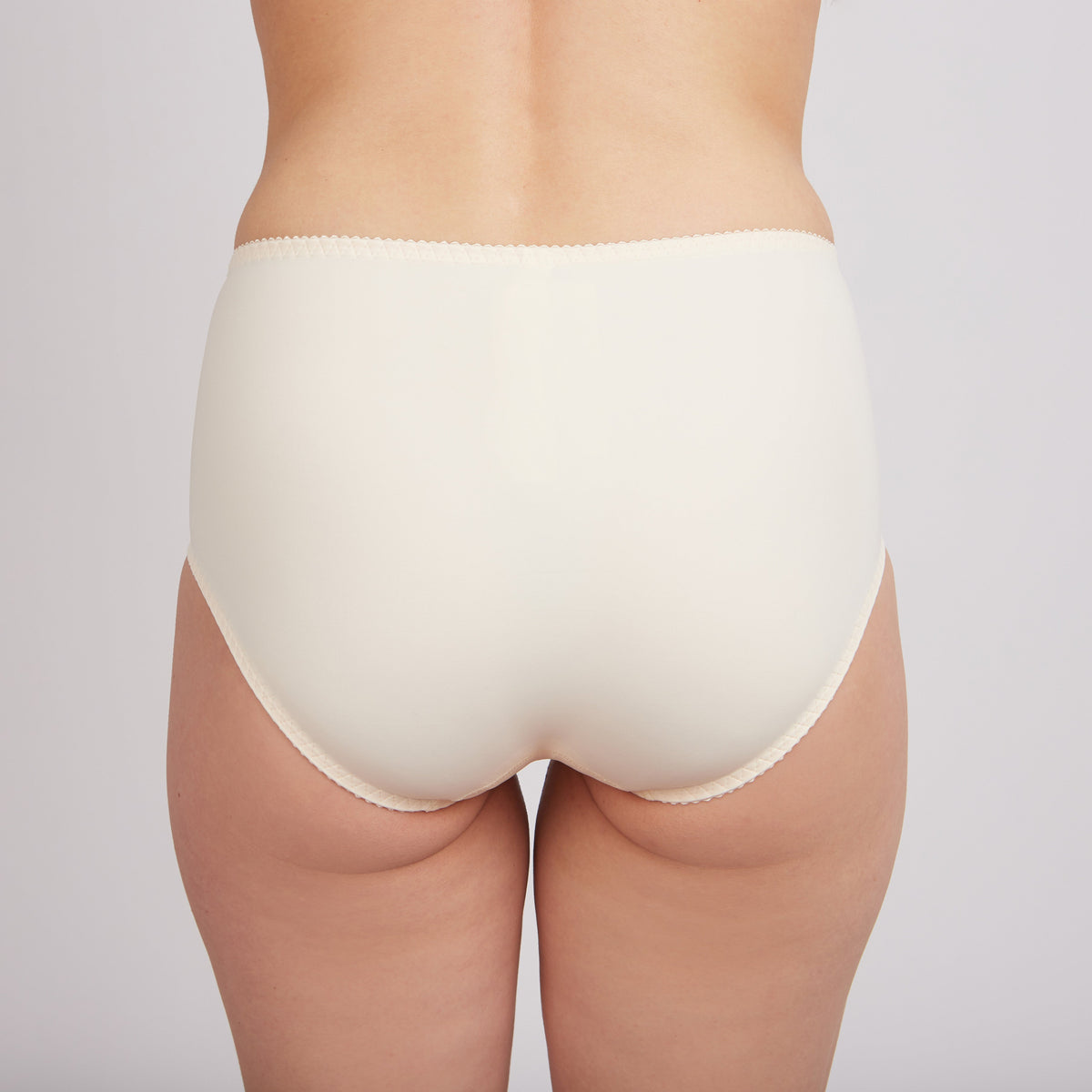 Nude high-waisted slip panties from the Crystal Curve collection by Lornea, featuring a smooth, fitted design for women.