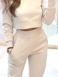 Apricot casual chic cropped sweatshirt and jogger set by Trendsi, featuring relaxed fit and comfortable fabric for everyday wear.