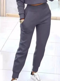Apricot casual chic cropped sweatshirt and jogger set by Trendsi, featuring comfortable fabric and stylish fit.