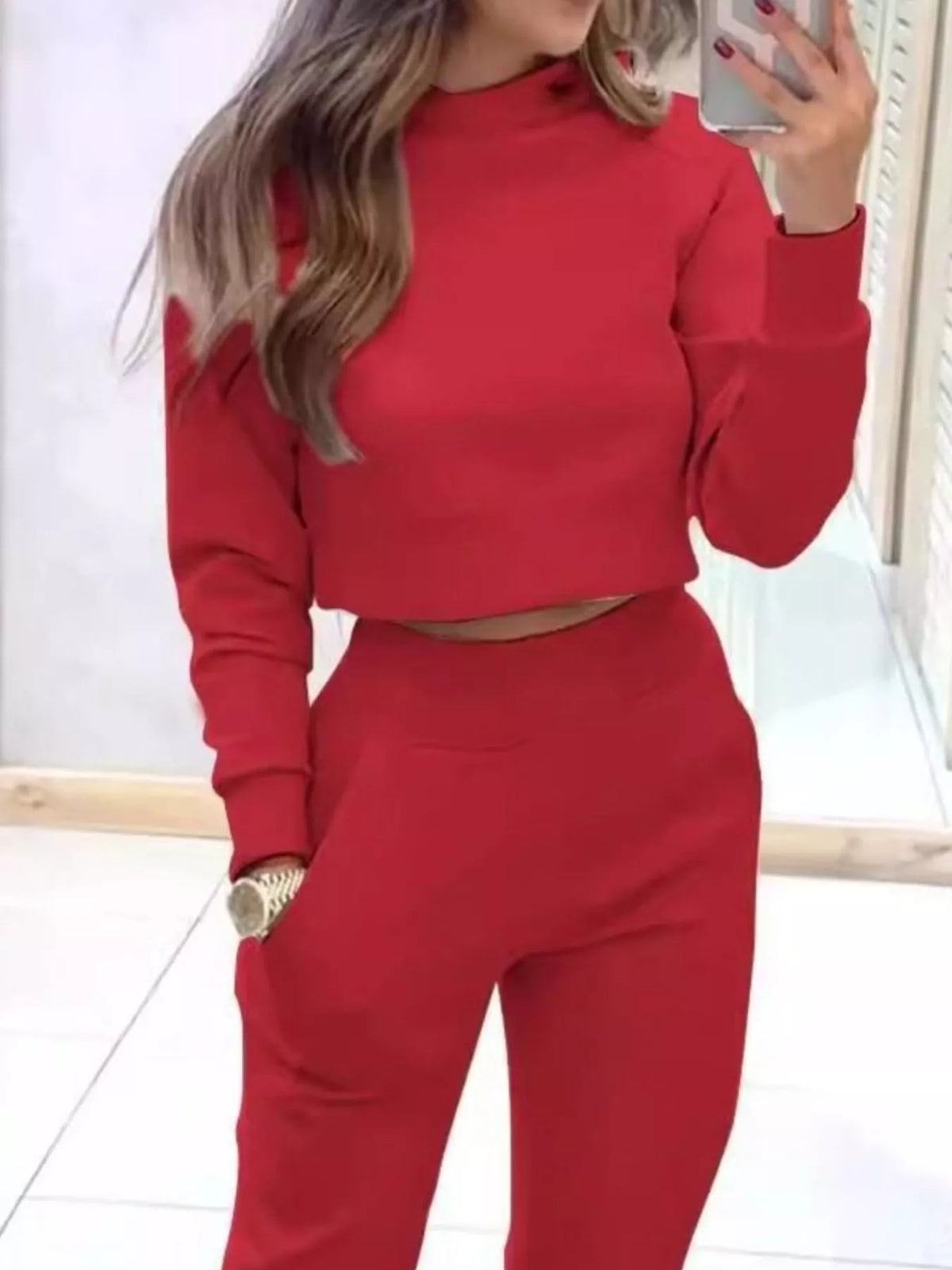 Apricot casual chic cropped sweatshirt and jogger set by Trendsi, featuring a stylish relaxed fit and comfortable fabric.