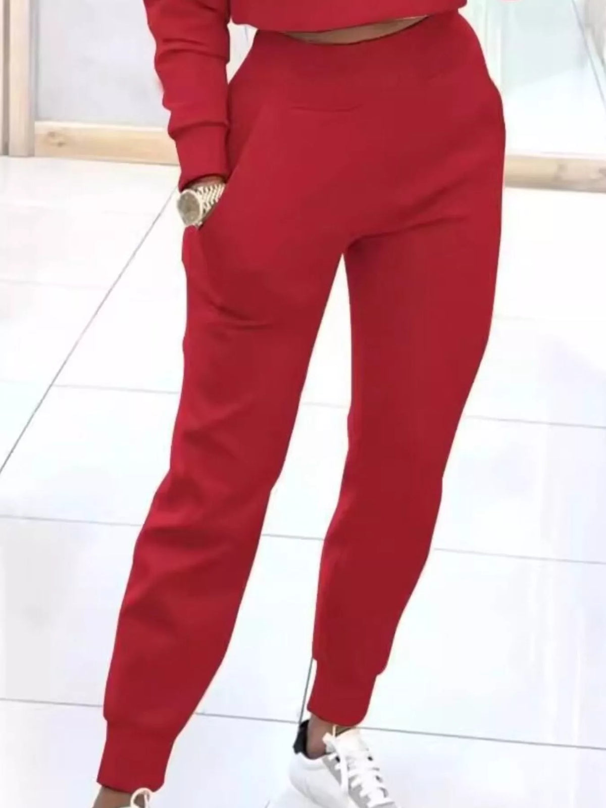 Apricot-colored casual chic cropped sweatshirt and jogger set by Trendsi, featuring comfortable, stylish loungewear for women.