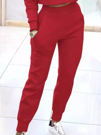 Apricot-colored casual chic cropped sweatshirt and jogger set by Trendsi, featuring comfortable, stylish loungewear for women.