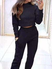 Apricot-colored casual chic cropped sweatshirt and jogger set by Trendsi, featuring comfortable, stylish loungewear for women.