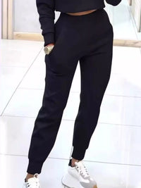 Apricot casual chic cropped sweatshirt and jogger set by Trendsi, featuring a comfortable, stylish loungewear ensemble.