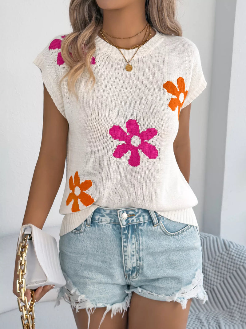 Apricot flower round neck sweater by Trendsi, featuring a cozy knit with floral design and ribbed collar.