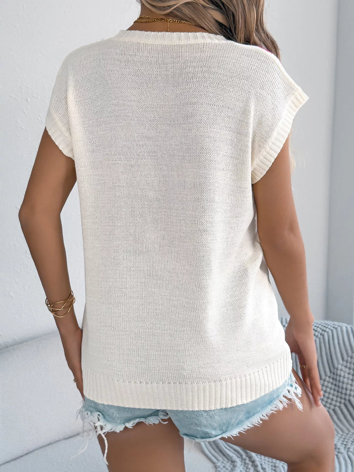 Apricot flower round neck sweater by Trendsi, featuring a cozy knit with floral pattern and a classic fit.