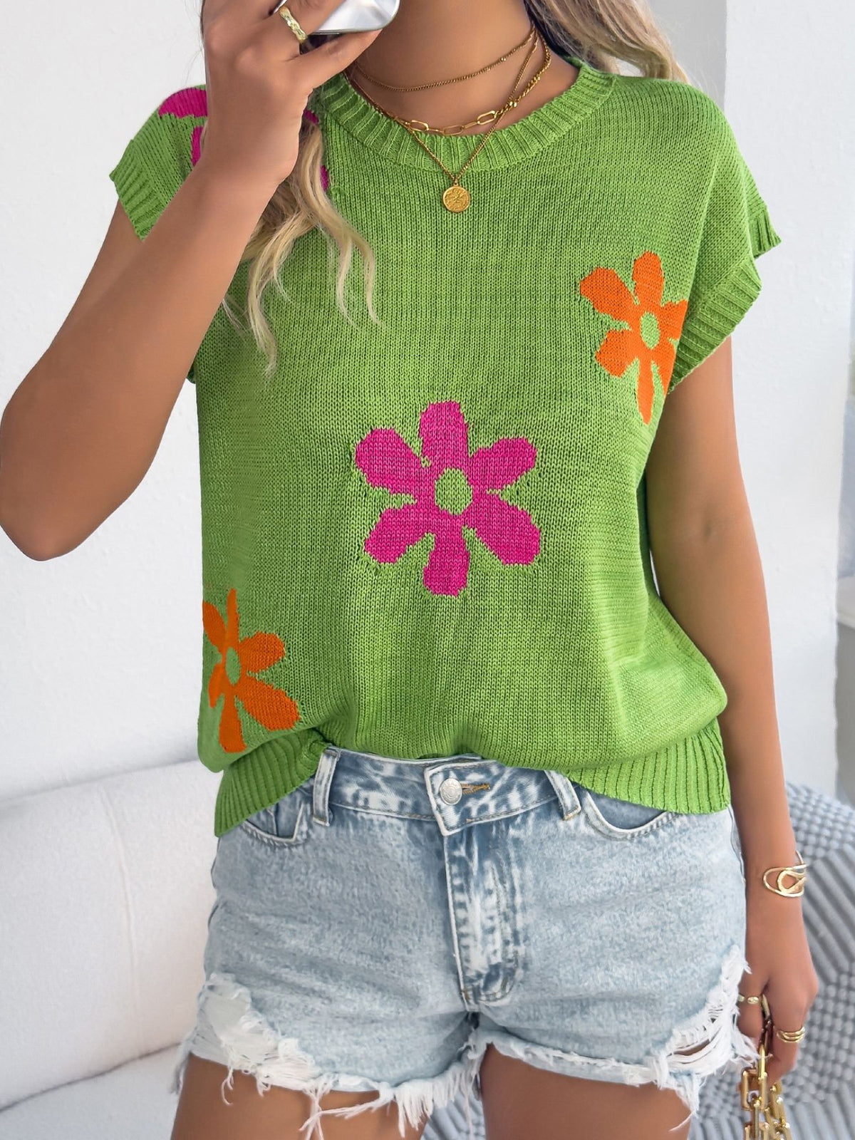 Apricot Flower Round Neck Sweater by Trendsi, featuring a floral print and soft knit fabric on a model.