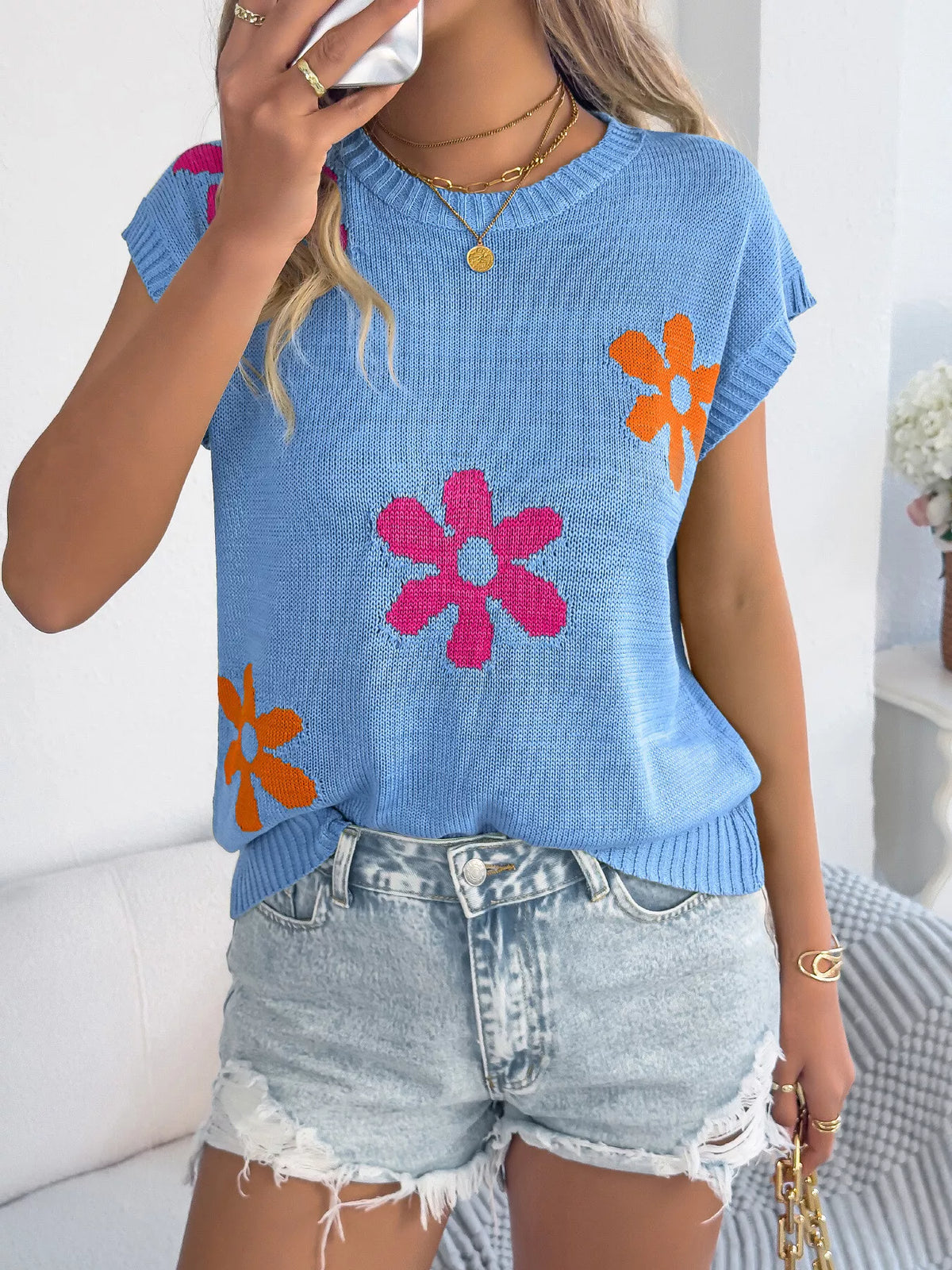 Apricot flower pattern round neck sweater by Trendsi, featuring a cozy knit fabric and floral design.