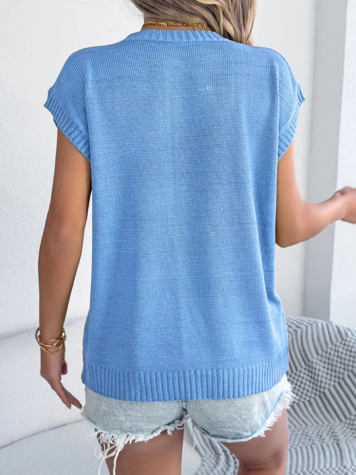 Apricot flower round neck sweater by Trendsi, featuring a cozy knit design with floral pattern and ribbed neckline.