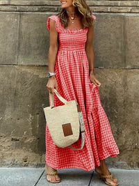 Beige plaid maxi dress with ruffle sleeves by Trendsi, featuring a flowing silhouette and stylish design.