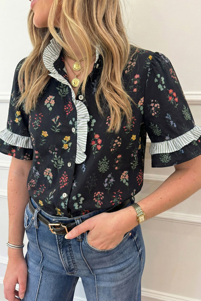 Black floral short sleeve shirt with contrast frilled trim from Trendsi, featuring a casual, feminine design.