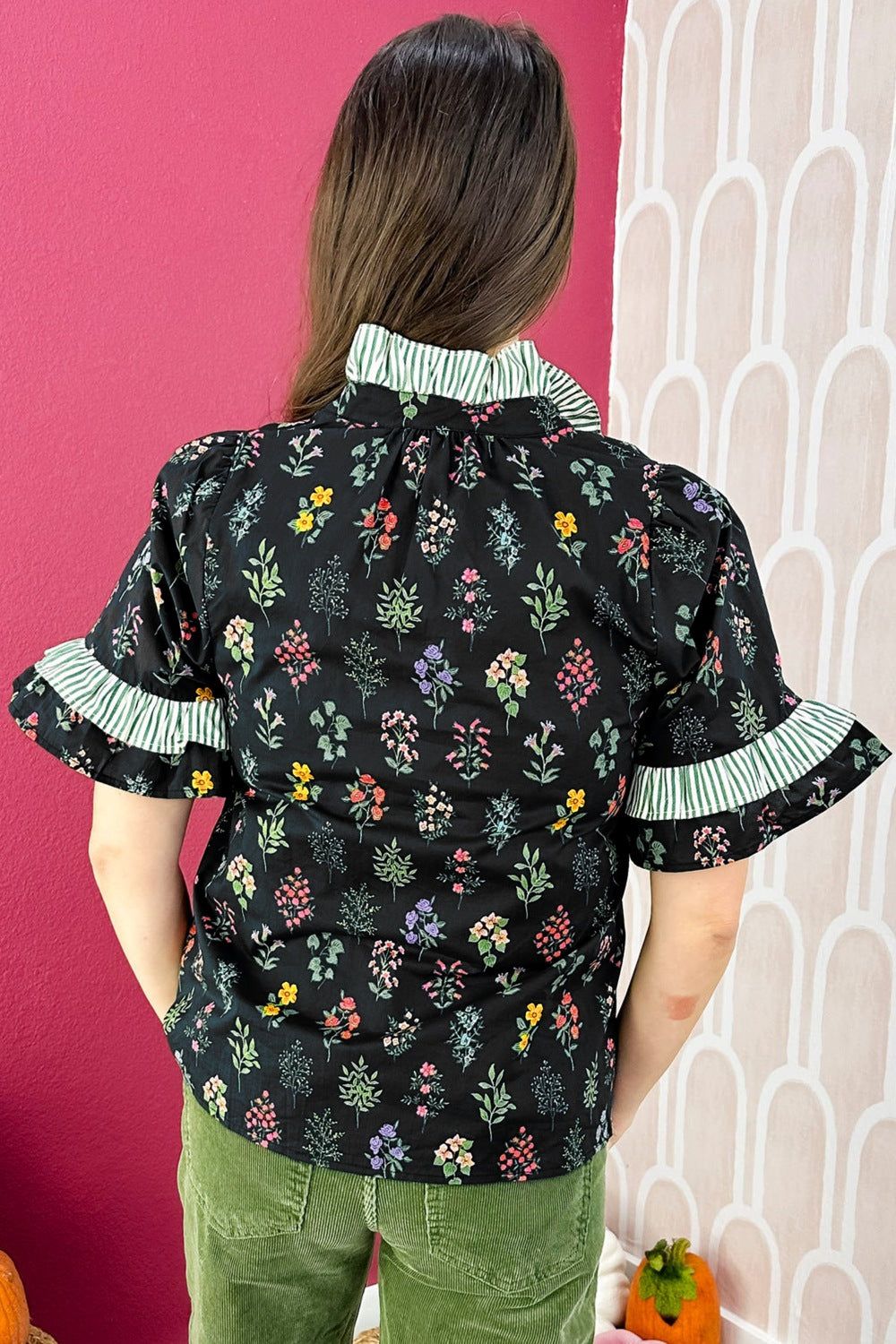 Black floral short sleeve shirt with contrast frilled trim from Trendsi, featuring a relaxed fit and vibrant floral pattern.