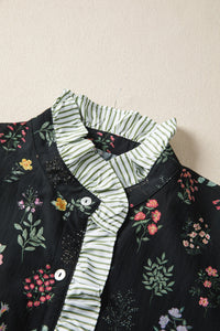 Black floral short sleeve shirt with contrast frilled trim from Trendsi, featuring a stylish and feminine design.