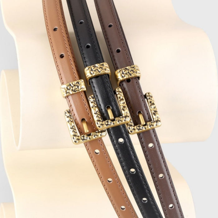 Leather skinny belt with metal buckle from Trendsi, featuring smooth black leather and a sleek, modern design.