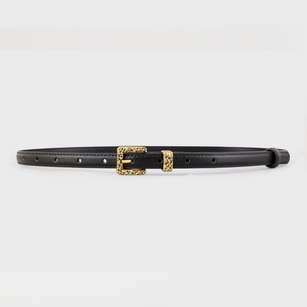 Black skinny leather belt with silver buckle from Trendsi, featuring a sleek design and smooth leather finish.
