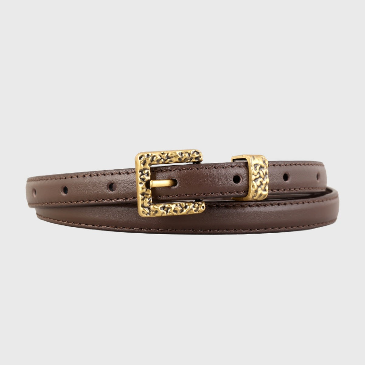 Leather skinny belt with a metal buckle, trendy accessory from Trendsi, featuring a sleek black design and adjustable fit.