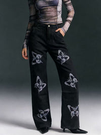 Black butterfly print high-waisted wide-leg jeans from Trendsi, showcasing the relaxed fit and stylish butterfly pattern.