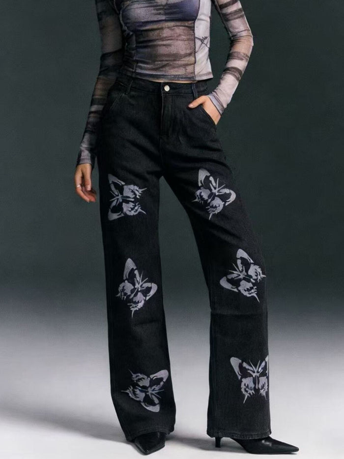 Black butterfly print high-waisted wide-leg jeans from Trendsi, showcasing the relaxed fit and stylish butterfly pattern.
