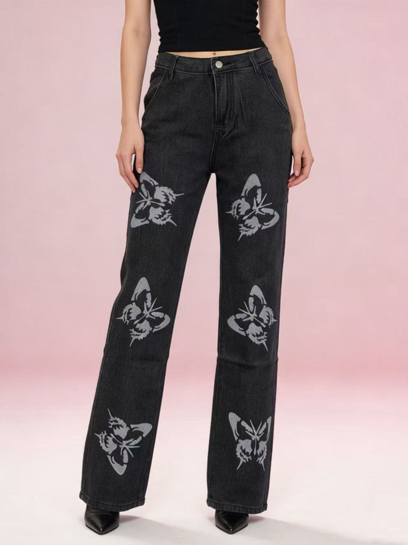 Black butterfly print high-waisted wide-leg jeans from Trendsi, featuring a relaxed fit and stylish floral pattern.