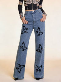 Black butterfly print high-waisted wide-leg jeans from Trendsi, featuring a relaxed fit and stylish floral design.