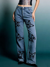 Black butterfly print high-waisted wide-leg jeans from Trendsi, featuring a relaxed fit and trendy design.
