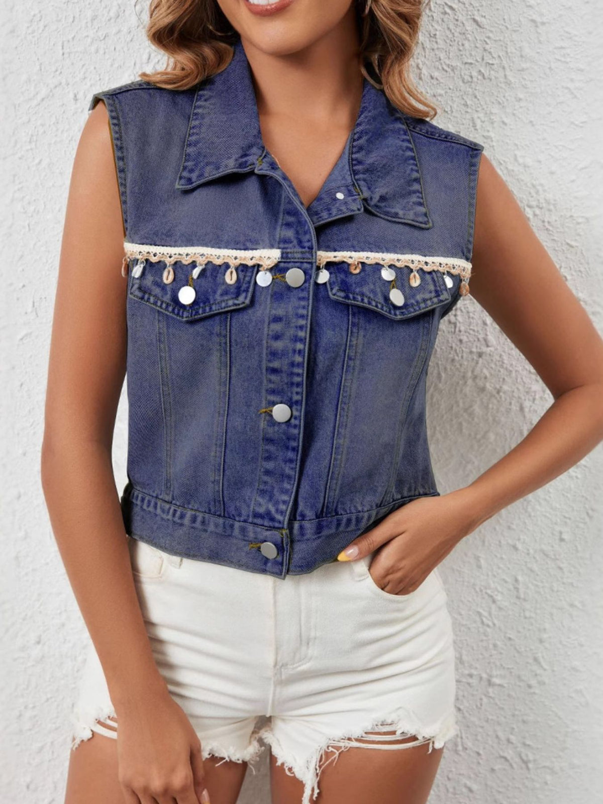 Black button-up denim vest from Trendsi, featuring classic collar and front button closure, displayed on a white background.