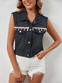 Black button-up denim vest by Trendsi featuring classic collar and front button closure, styled with casual apparel.