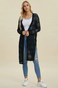 Black Trendsi Double Take open front longline cardigan hanging on a rack, showcasing its relaxed fit and draped style.