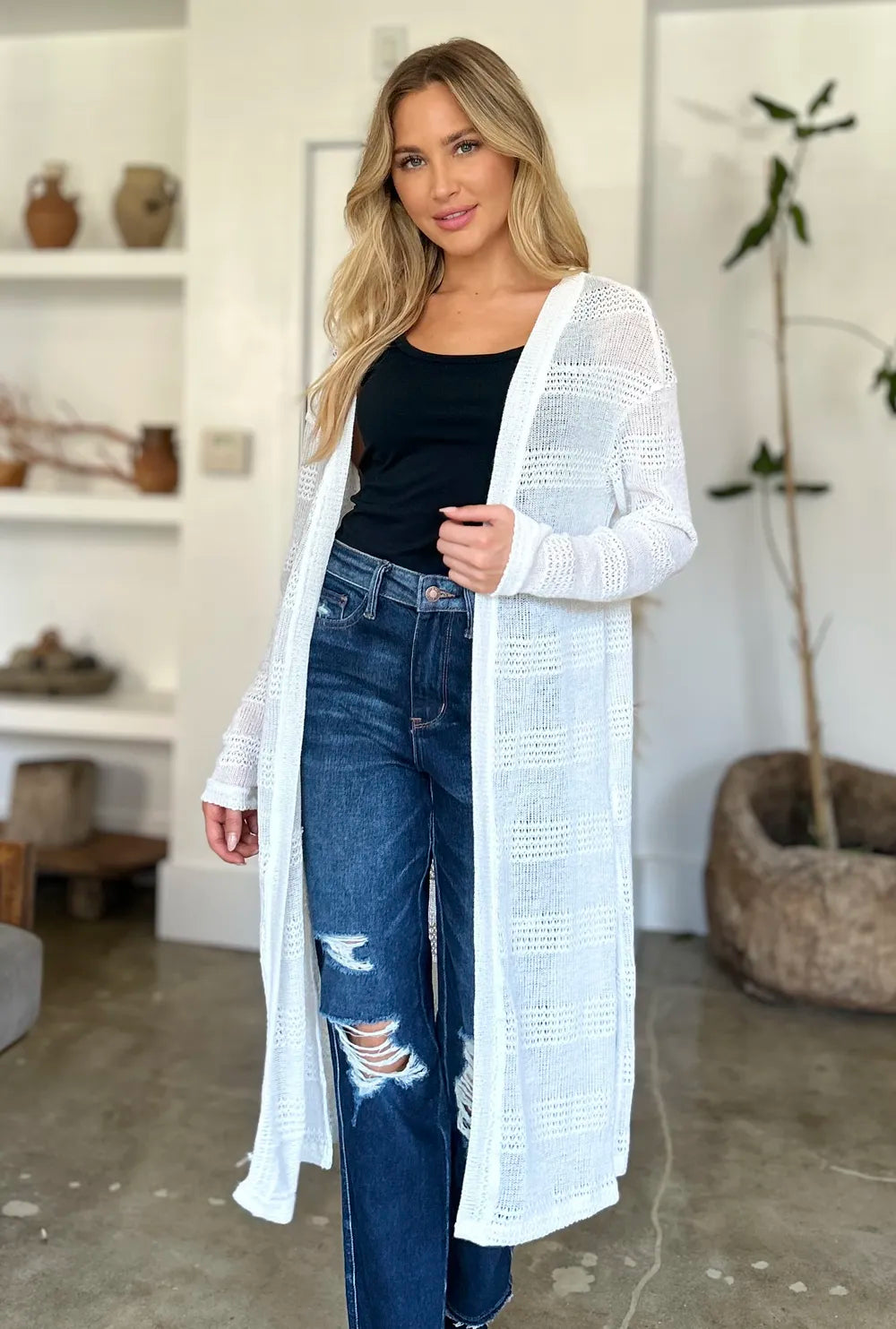 Black Trendsi Double Take full-size open front longline cardigan displayed on a model, showcasing its relaxed fit and long silhouette.