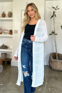 Black Trendsi Double Take full-size open front longline cardigan displayed on a model, showcasing its relaxed fit and long silhouette.
