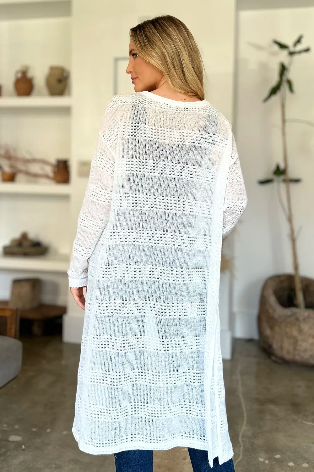 Black Trendsi Double Take full-size open front longline cardigan drapes open, showcasing its relaxed, cozy fit and lightweight fabric.