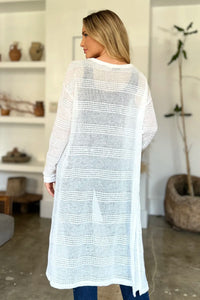 Black Trendsi Double Take full-size open front longline cardigan drapes open, showcasing its relaxed, cozy fit and lightweight fabric.