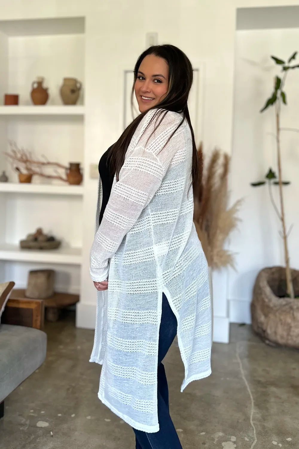 Black Trendsi Double Take open front longline cardigan, full size, featuring a relaxed fit and long sleeves on a model.