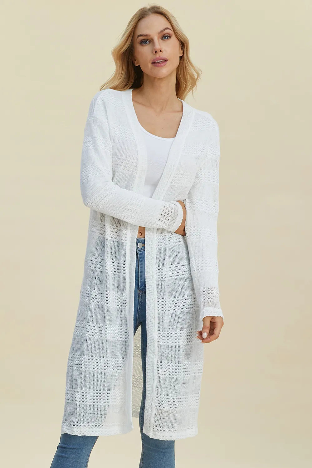 Black Trendsi Double Take full-size open front longline cardigan displayed on a model, showcasing its relaxed fit and draped style.