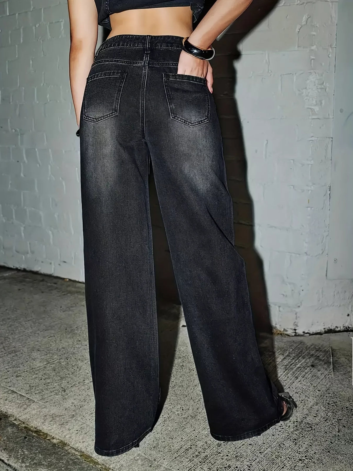 Rhinestone embellished wide-leg jeans by Trendsi featuring sparkling rhinestones and a relaxed fit in denim fabric.