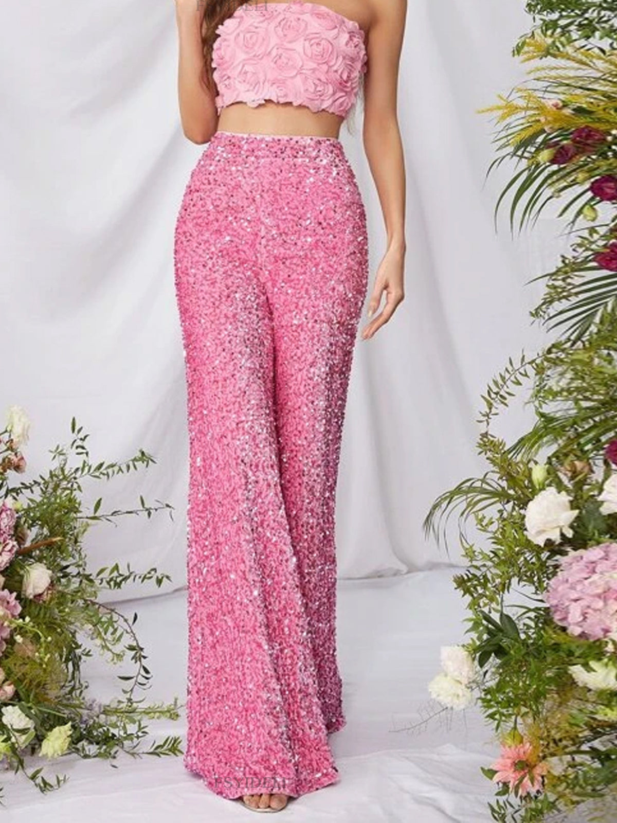 Sequin embellished wide-leg pants by Trendsi featuring shimmering sequins and flowy wide-leg design on a model.
