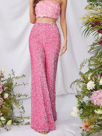 Sequin embellished wide-leg pants by Trendsi featuring shimmering sequins and flowy wide-leg design on a model.