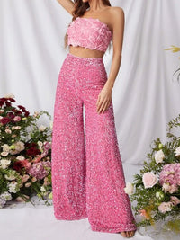 Sequin embellished wide-leg pants in black with shimmering sequins, stylish and flowing for a trendy look.