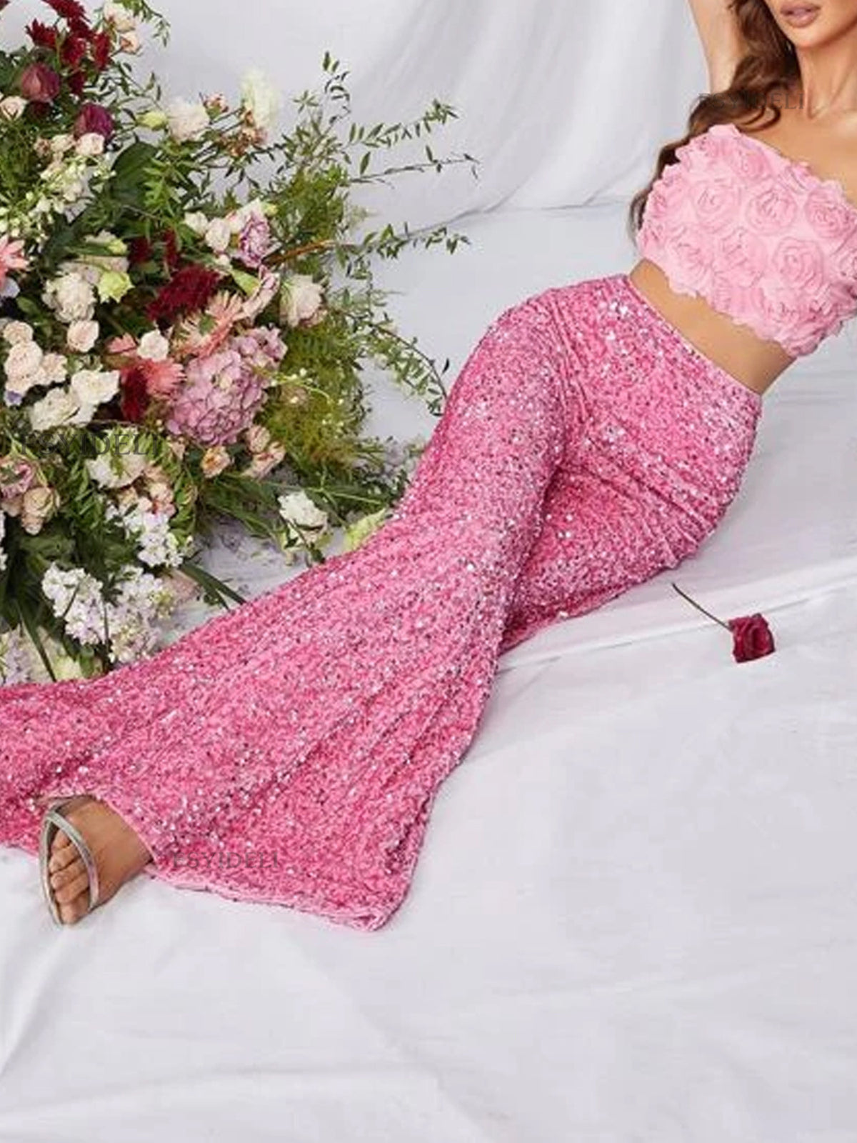 Sequin embellished wide-leg pants by Trendsi, featuring shiny sequins and a flowing wide-leg design, shown on a model.