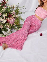 Sequin embellished wide-leg pants by Trendsi, featuring shiny sequins and a flowing wide-leg design, shown on a model.