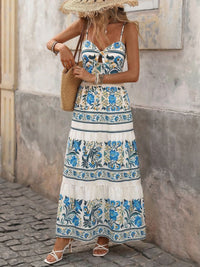 Floral print sweetheart neck maxi dress by Trendsi, featuring a flowy silhouette and vibrant floral pattern perfect for summer wear.