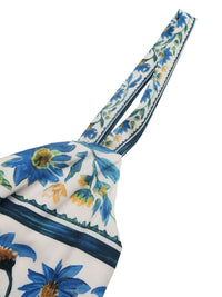 Floral print sweetheart neck maxi dress by Trendsi featuring a flowy silhouette and vibrant floral pattern.